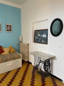 a bedroom with a table and a bed in it at Oasi nel Salento in Tricase