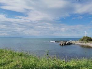 a view of a body of water with a cross at Appart complex - Egrek 4 in Lozenets