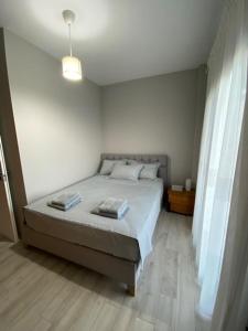 a bedroom with a bed in a room at Luxury Villa Esmeralda in Sozopoli