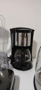 a black blender sitting on top of a counter at Relax nouvelle ville ibn batouta2 in Oulad Akkou