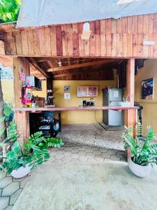 an outside view of a kitchen in a building at Casa Shula 1 AC Starlink 2min walk to the beach in Brisas de Zicatela