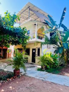 a house with plants in front of it at Casa Shula 1 AC Starlink 2min walk to the beach in Brisas de Zicatela