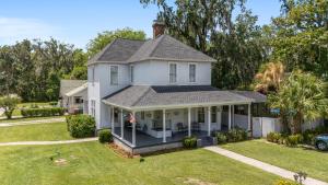 an image of a house with a porch at Martin B- historic district apt with pool in Ocala