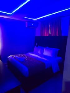 Postel nebo postele na pokoji v ubytování Preserve Hotel Ilupeju