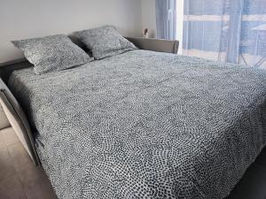 Ένα ή περισσότερα κρεβάτια σε δωμάτιο στο Le cocon