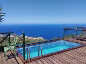 a swimming pool with a view of the ocean at Apartment Mariposa Azul in Icod de los Vinos