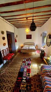 a bedroom with a bed and a rug on the floor at Casa de Dona Concha Apartments Ugijar in Ugíjar +233 photos