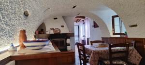 a kitchen with a table with a bowl on top of it at La Casetta 23 in Perledo +35 photos