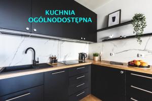 a kitchen with a sink and a counter top at MiraMar - Parking, wi-fi, Kuchnia ogólnodostępna in Krynica Morska