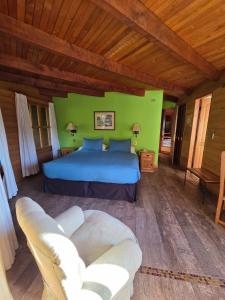 Postel nebo postele na pokoji v ubytování Hotel Malalhue