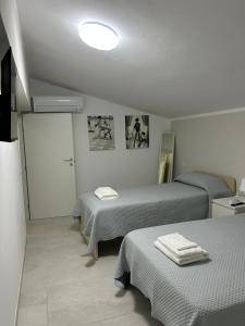 Postel nebo postele na pokoji v ubytování B&B Telko