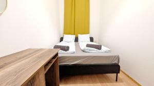 Postel nebo postele na pokoji v ubytování Spacious Rooms - 15 Min from Airport & City Center, 5 Min from Vienna Main-Bus Station EZ8