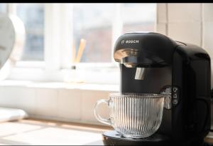 a coffee maker sitting on top of a counter at City centre, NTU, Victoria Centre, Motorpoint Arena, parking in Nottingham