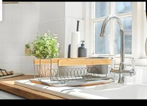 a kitchen sink with a dish drying rack on it at City centre, NTU, Victoria Centre, Motorpoint Arena, parking in Nottingham