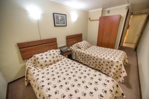 Postel nebo postele na pokoji v ubytování Hotel Sahara Inn