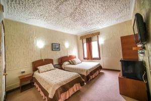 Postel nebo postele na pokoji v ubytování Hotel Sahara Inn