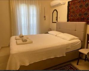 a bedroom with a bed with two towels on it at Villa Caretta Luna in Ortaca