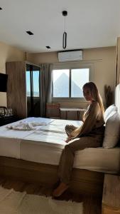 Voodi või voodid majutusasutuse Moonlight pyramids view INN toas
