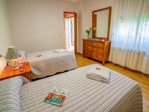 A bed or beds in a room at Chalet in La Omañuela near Ski Resort