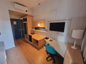 Stay Inn Santos Sua acomodação com cara de Hotel的厨房或小厨房