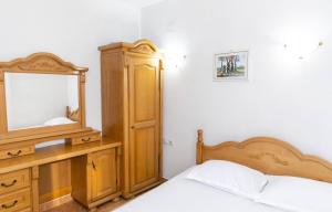 a bedroom with a bed and a dresser and a mirror at Villa Duraku in Ulcinj +54 photos