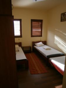 Ein Bett oder Betten in einem Zimmer der Unterkunft Nyárfás Vendégház