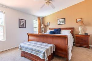 a bedroom with a bed and a ceiling fan at Mariposa Ridge Retreat in Mariposa