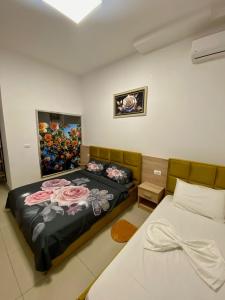 Postel nebo postele na pokoji v ubytování AA Boutique Hotel
