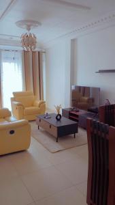 Posezení v ubytování MAISON SUISSE Emana Yaoundé, Appartements meublés de luxe + 9 fotografií