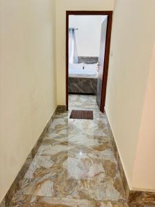 a hallway with a door leading to a bedroom at Juyal palace in Jāmb