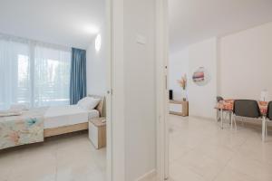 Postel nebo postele na pokoji v ubytování Vacanze Residence Mimose