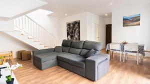 a living room with a couch and a table at Casa Amy-Costa Teguise in Costa Teguise