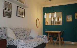 a living room with a couch and a table at Il Glicine in Livorno