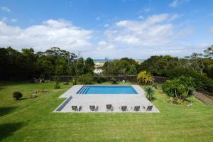 an image of a swimming pool in a yard at Casa das Hortências by Azoresrent in Farroupo