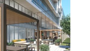 an rendering of the lobby of a building with tables and chairs at Staybridge Suites Toronto Airport East by IHG in Toronto