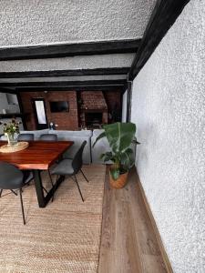a dining room with a table and a plant at Exclusive luxury apartment, central in Rosenheim +8 photos