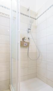a shower with a glass door in a bathroom at Cá Stella studio Flat in Riomaggiore