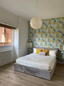 Postel nebo postele na pokoji v ubytování Pit Stop Apartment 2K23 - MXP - Busto Arsizio