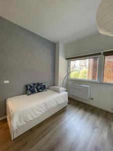 Postel nebo postele na pokoji v ubytování Pit Stop Apartment 2K23 - MXP - Busto Arsizio + 10 fotografií