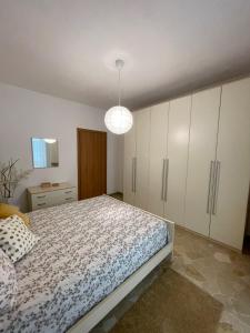 Postel nebo postele na pokoji v ubytování Pit Stop Apartment 2K21 - MXP - Busto Arsizio