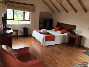 Postel nebo postele na pokoji v ubytování hotel el portal de las Flores, Alojamiento Rural