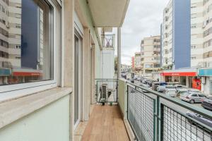a balcony with a view of a city street at 2-bedroom gem Central Odivelas in Odivelas