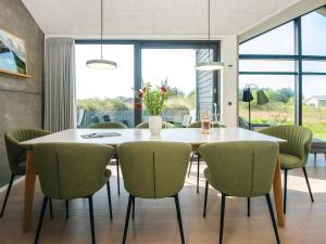 a dining room with a table and chairs at 8 person holiday home in Hirtshals-By Traum in Hirtshals