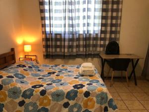 Ένα ή περισσότερα κρεβάτια σε δωμάτιο στο Casa Buenas Olas a 5 minutos