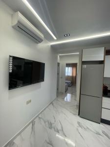 TV a/nebo společenská místnost v ubytování Oumaira Residence Azla-Tetouan