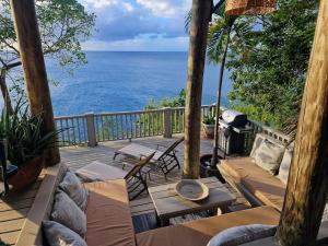 a patio with a view of the ocean at Lowena Cottage in Tortola Island