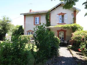 an old house with a garden in front of it at Maison de charme avec grand parc pour des vacances en famille au cœur de l'Auvergne - FR-1-582-278 in Bournoncle-Saint-Pierre