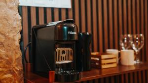 a coffee maker sitting on top of a table at Wellness Paradise mit Whirlpool in Bochum