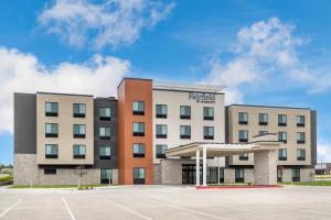 an exterior view of a hotel with a basketball court at Fairfield by Marriott Inn & Suites Norwalk in Norwalk