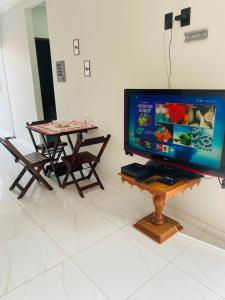 TV a/nebo společenská místnost v ubytování Casa Inteira Aconchegante com Garagem